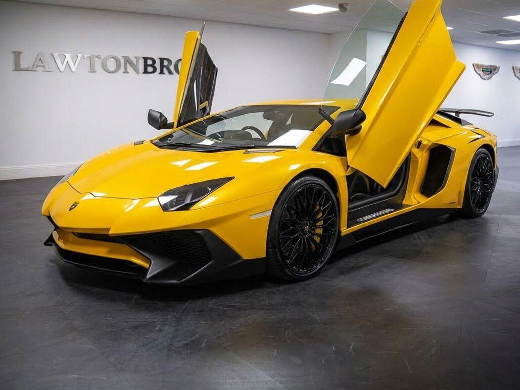 A Lamborghini Aventador with its doors open at Lawton Brook